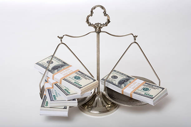 istock US currency on scale of justice 172359024