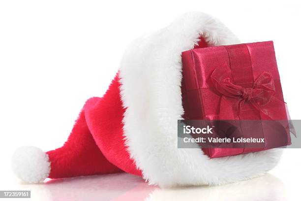Christmas Present In Santa Hat Stock Photo - Download Image Now - Box - Container, Celebration Event, Christmas