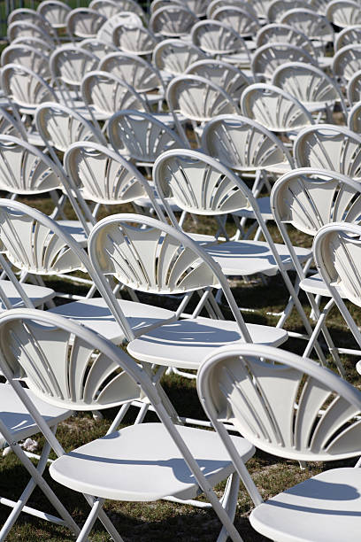 istock Group of empty folding chairs in row at wedding event 172359191