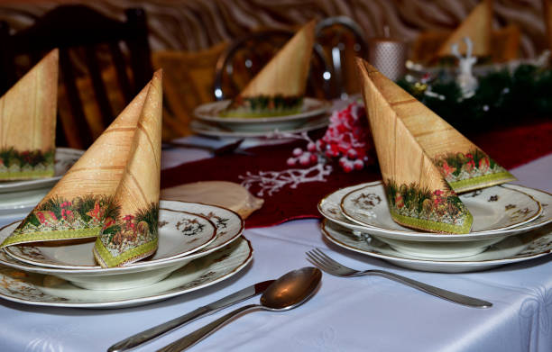 Close-up detail of a decorated Christmas table in a home during night stock photo