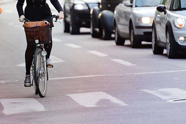 istock Girl on bicycle in traffic 172360081