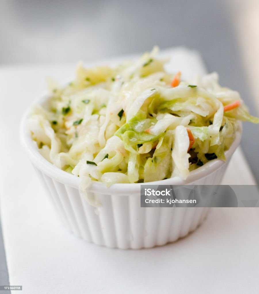 Side of Cole Slaw Freshly made cole slaw (cabbage salad) at an American barbecue restaurant. Coleslaw Stock Photo