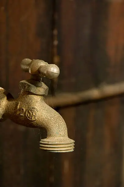Old Water Faucet with cobwebs reflecting water shortage or drought conditions