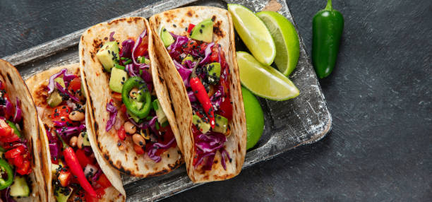 istock Mexican street tacos flat lay composition with lime, pepper and sauce 1723604957