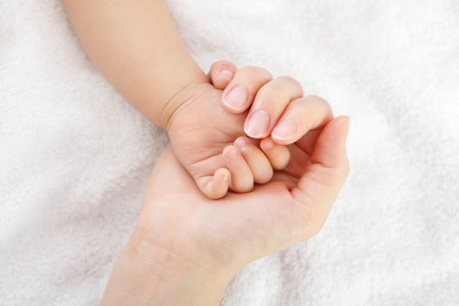 little baby hand with mother hand, close up, concept for love