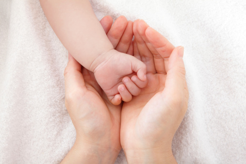 little baby hand with mother hand, close up, concept for love