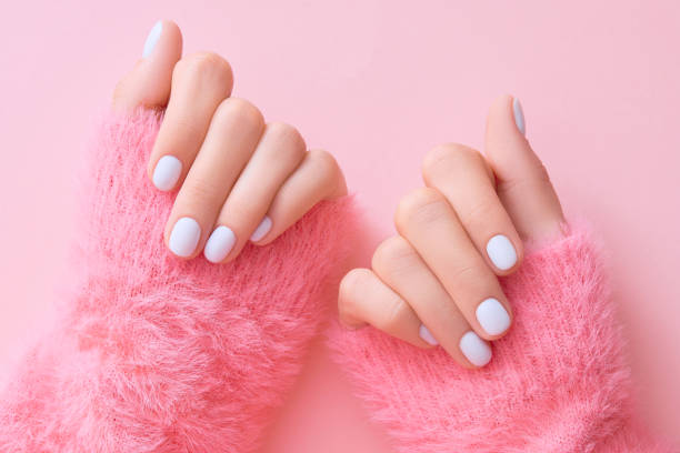 istock Close up womans hands with white manicure 1723610432