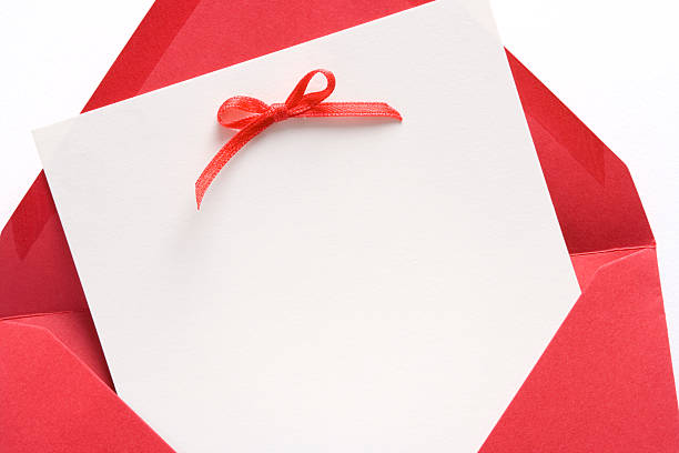 Luxury invitation with a touch of fiery romance - red satin bow and cream colored card in bright red envelope. Similar:
