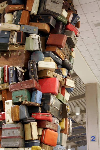 istock Suitcases stacked dangerously and disorderly in a room 172361304
