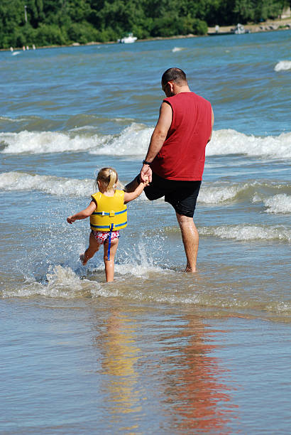 istock Kicking Water at the Beach 172362064