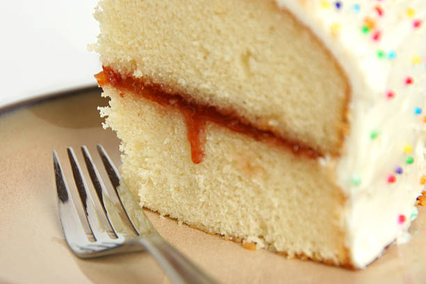 Delicious slice of birthday cake stock photo