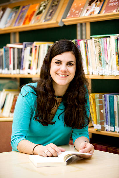 istock A smiling teenage student in her college library. 172362655
