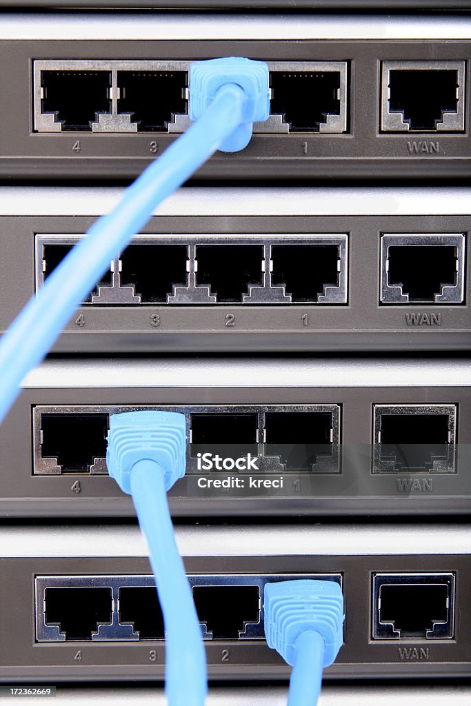Network routers. Computer network routers with 3 connected rj45 cables.Similar photos: Bandwidth Stock Photo