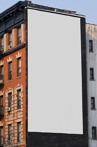 Close up of the building's roofs in Chinatown district. Several graffiti on top of these old brick wall buildings. New York City, USA.
