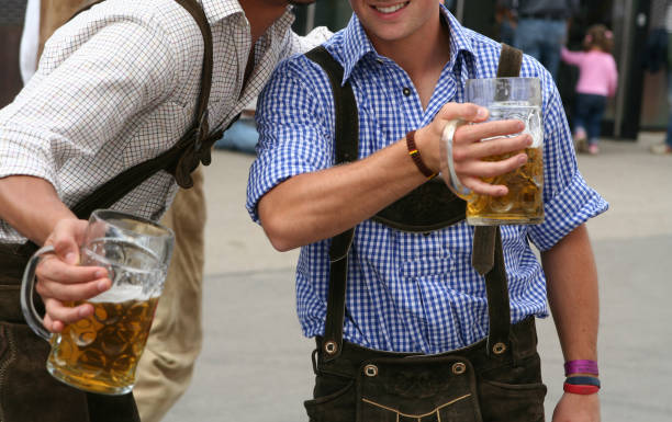 Two men with beer mug at the Octoberfest in Munich stock photo