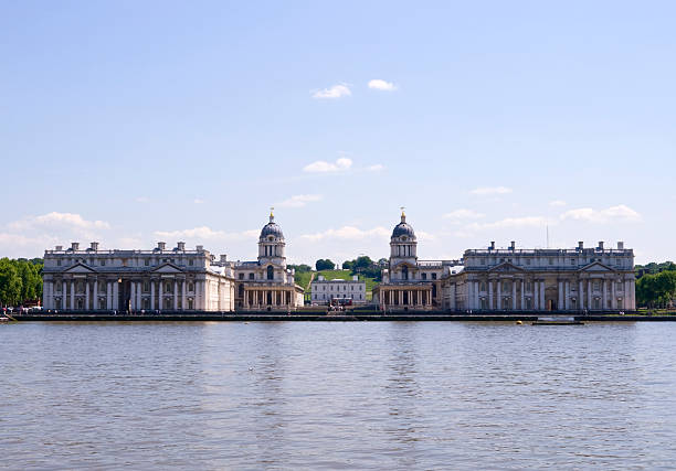 Greenwich old Royal Naval College from the RIver Thames "The former Royal Naval College at Greenwich, seen from the north bank of the River Thames. The Queen's House is visible through the two blocks of the College and the Royal Observatory is at the top of the hill.More River Thames scenics:" queen's house stock pictures, royalty-free photos & images