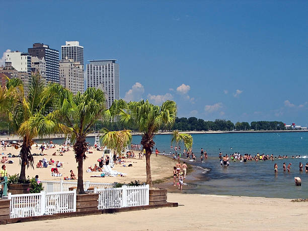 Chicago, Illinois, USA : July 29, 2025 Summer scene on the Lakefront Trail. Tourists and locals enjoy a beautiful Summer day on Lake Michigan. Located in the Streeterville area, looking towards the Gold Coast.