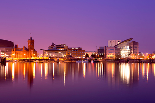 A tranquil scene of Cardiff Bay on a calm evening. In this city scape you can see the Pierhead building (1897) and National Assembly for Wales with the Bay in the foreground.