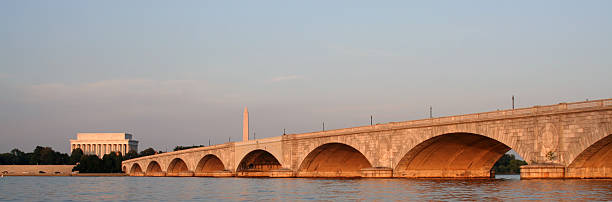 Arlington Bridge, Lincoln Memorial and National Monument, Washington DC Arlington Memorial Bridge with the Lincoln Memorial and the National Monument in the background shot in the golden glow of the setting sun. arlington memorial bridge photos stock pictures, royalty-free photos & images