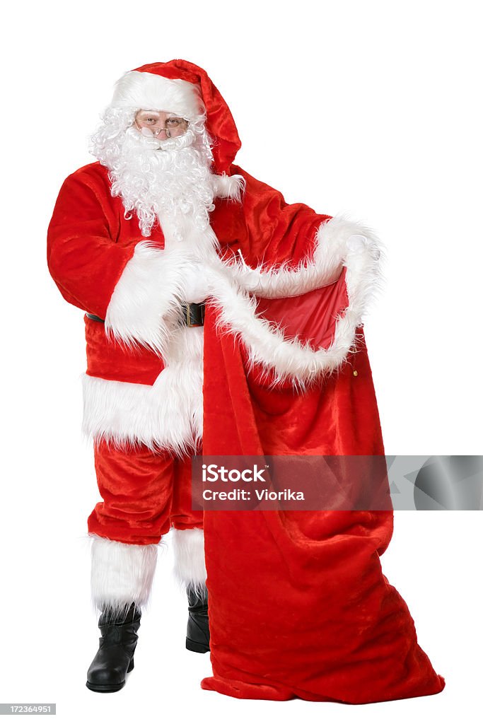 Santa with his sack "Traditional Christmas Santa showing his big opened sack of gifts, isolated on white." Happiness Stock Photo