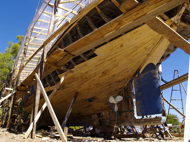 scaffolded wooden yacht scaffolded wooden yacht in shipyard near fethiye, turkey. bilge of ship stock pictures, royalty-free photos & images