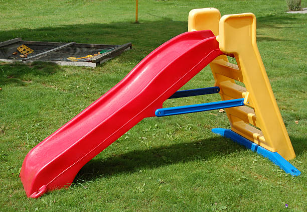 istock Kids colorful playgrounds slide on grass 172366040