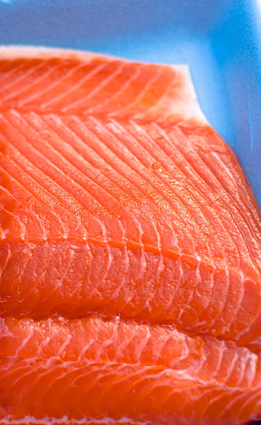Fresh Seafood Fish in Package, Sockeye Salmon "Sockeye salmon, offered seasonally at seafood or fish markets, is a leaner salmon variety with a bright red flesh (SEE LIGHTBOXES BELOW for similar photos & many more cooking and food photos...)" sockeye salmon filet stock pictures, royalty-free photos & images