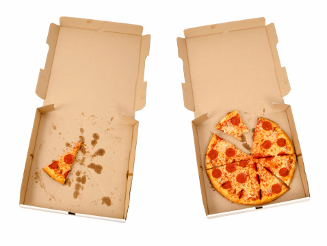 Picture of two pizzas in pizza boxes.