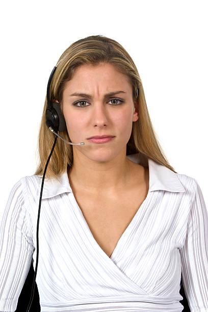 frowning call center operator beautiful female call center operator, headset customer service isolated on white background ... http://istock.sk-websolutions.at/img/istock-banner-jr11.jpg jacraa2007 stock pictures, royalty-free photos & images