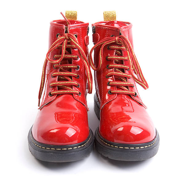 bottes rouges - isolated on red photos et images de collection