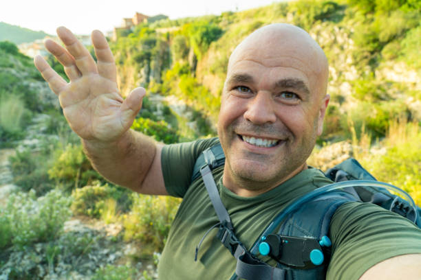 istock Happy hiker man takes a selfie in the forest 1723675932
