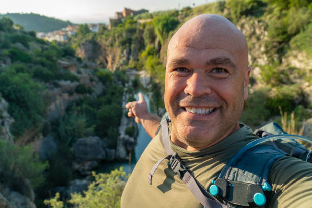 istock Happy hiker man takes a selfie in the forest 1723676336