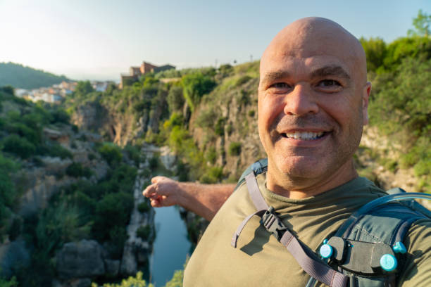 istock Happy hiker man takes a selfie in the forest 1723676338