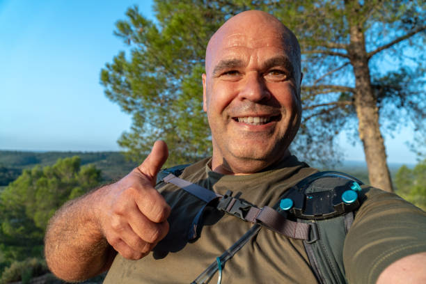 istock Happy hiker man takes a selfie in the forest 1723677927