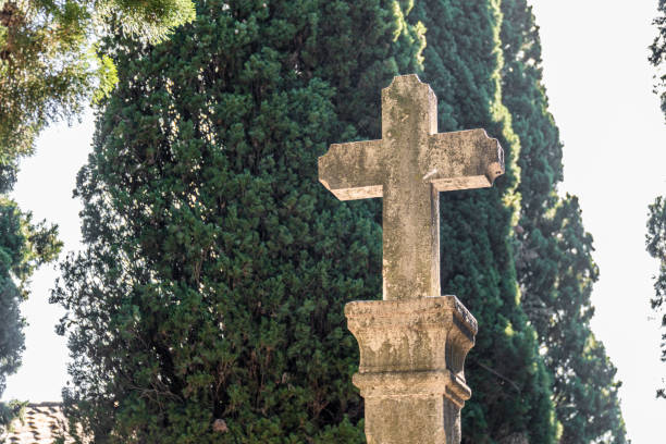 istock Stone old cross outdoors in the cemetery 1723680116