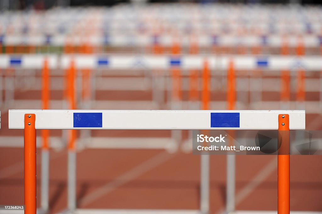 Hurdles lined up on a track, fading focus. Hurdles lined up on a track during a track and field meet; fading focus. Competition Stock Photo