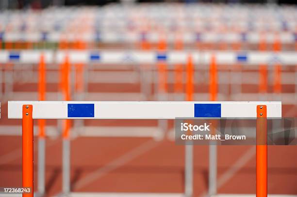 Hurdles Lined Up On A Track Fading Focus Stock Photo - Download Image Now - Competition, Competition Round, Education Event
