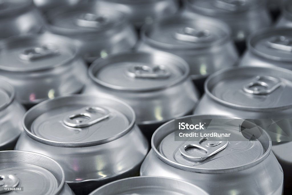 Beverage Lots of soda/beer cans in rows. Focus on closest can.Other drink can images: Can Stock Photo