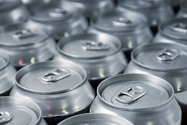 Beverage Lots of soda/beer cans in rows. Focus on closest can.Other drink can images: aluminum stock pictures, royalty-free photos & images