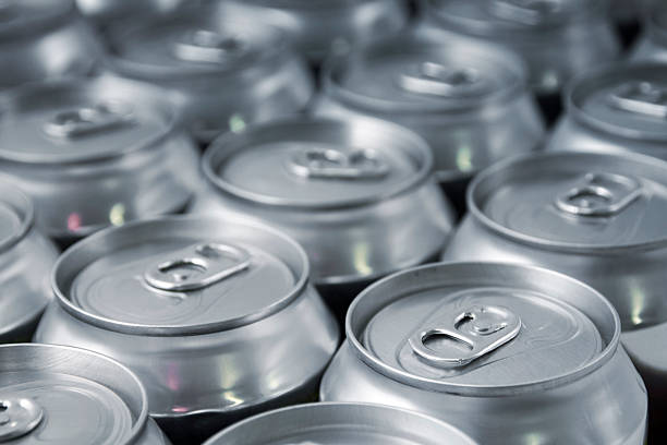 Beverage Lots of soda/beer cans in rows. Focus on closest can.Other drink can images: cans stock pictures, royalty-free photos & images