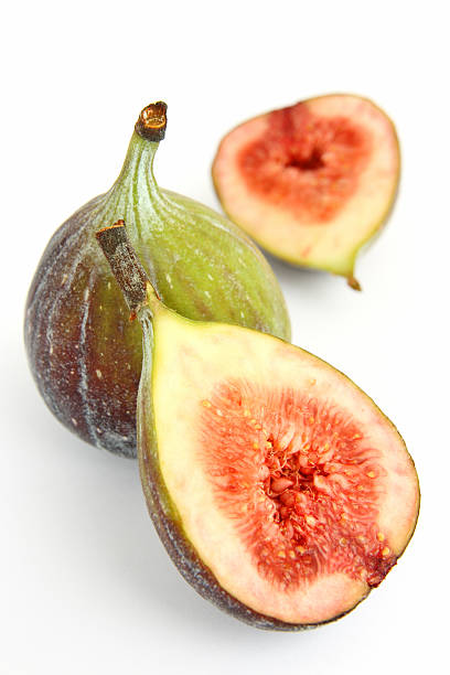 istock One sliced fig, and one whole fig, on a white background 172368505