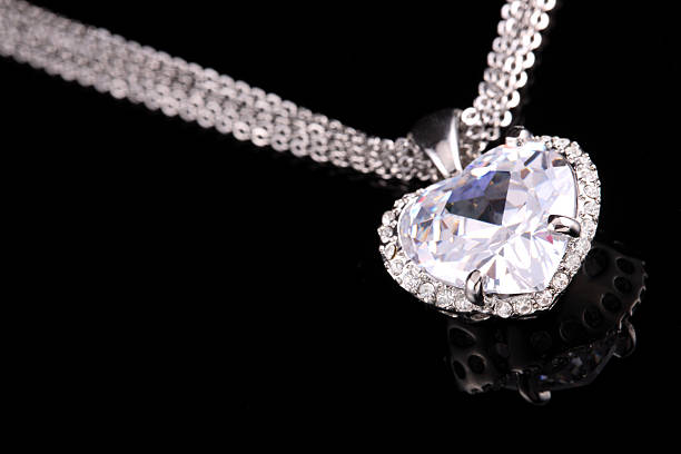 istock Shiny, heart-shaped diamond pendant on silver colored chain  172369175