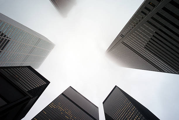 istock Office buildings in fog 172369467