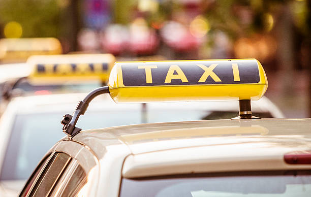 istock Yellow taxi sign and cab 172369680