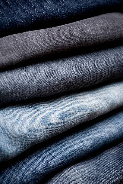 istock Close-up of a stack of different colored folded denim 172370463