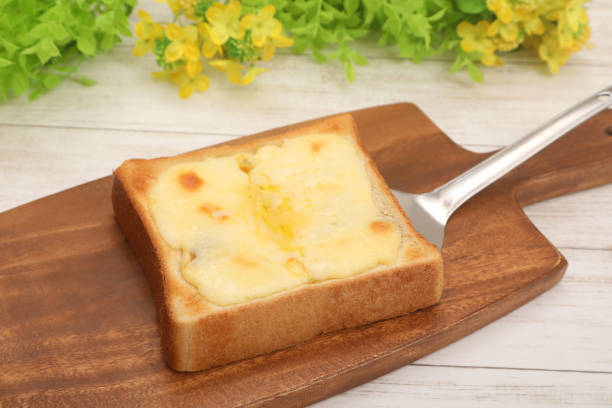 Toast with melted and stretched cheese