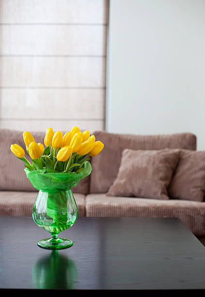 istock Yellow tulips bouquet in a modern living room. 172371105