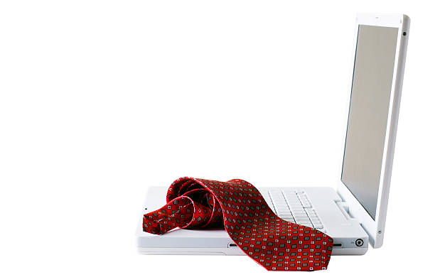 Silk tie on laptop stock photo