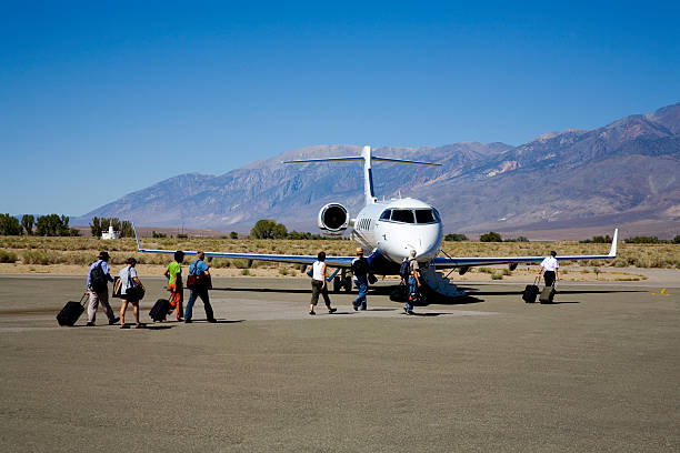 Charter Jet and Passengers stock photo