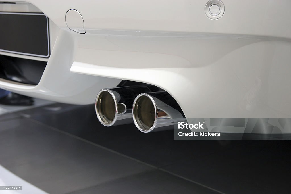 Exhaust pipe of white sports car "Exhaust pipe of white sports car, close up" Exhaust Pipe Stock Photo